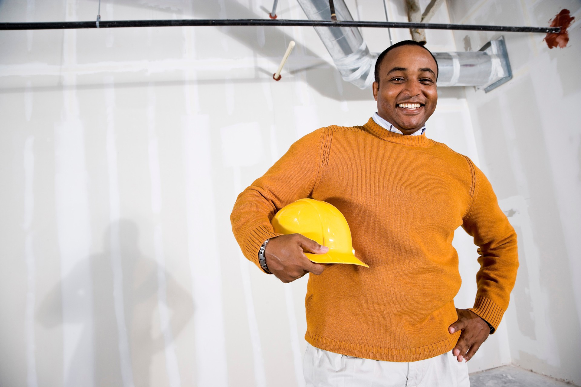 African American businessman in empty office space ready for buildout