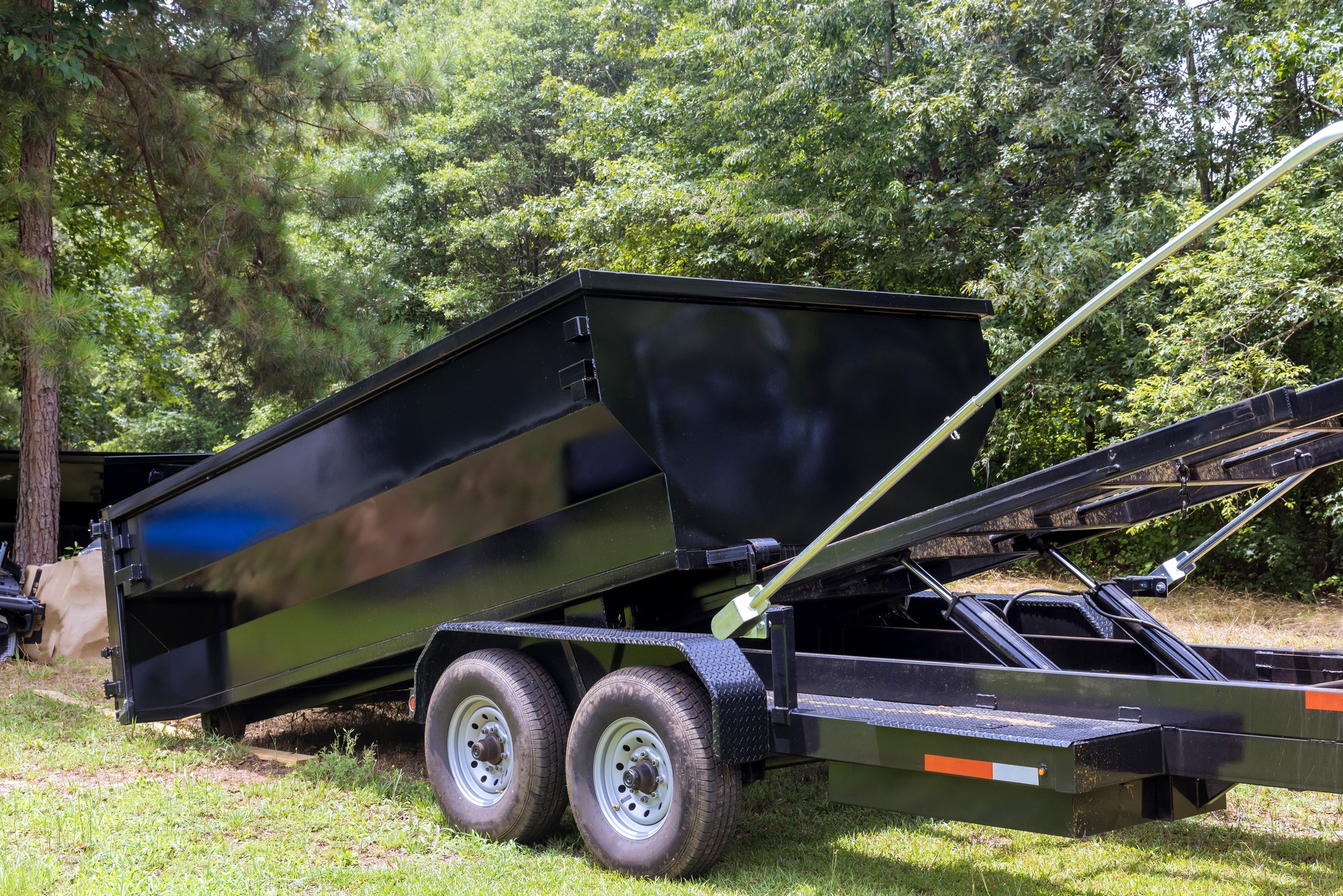 In order to recycle garbage, a metal container trash dumpster is used